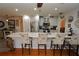 Modern kitchen with white cabinets, marble countertops, and breakfast bar with seating at 726 Macedonia Dr, Punta Gorda, FL 33950