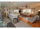 Open concept kitchen and living room with a large island, hardwood floors, and comfortable seating at 726 Macedonia Dr, Punta Gorda, FL 33950