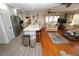 Open concept kitchen and living area with hardwood floors and a large island at 726 Macedonia Dr, Punta Gorda, FL 33950