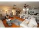 Open concept living room with hardwood floors, comfortable seating, and kitchen views at 726 Macedonia Dr, Punta Gorda, FL 33950