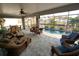 Relaxing screened pool area with patio furniture and canal views at 726 Macedonia Dr, Punta Gorda, FL 33950
