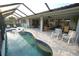Inviting heated pool with screened enclosure and canal views at 726 Macedonia Dr, Punta Gorda, FL 33950