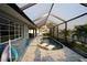 Relaxing kidney shaped pool with a screened enclosure at 726 Macedonia Dr, Punta Gorda, FL 33950