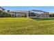 Large backyard with spacious grassy area and screened pool at 1070 March Dr, Port Charlotte, FL 33953