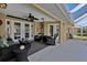 Covered patio with wicker furniture near the pool at 1070 March Dr, Port Charlotte, FL 33953