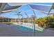 Inviting swimming pool and spa with a screened enclosure at 1070 March Dr, Port Charlotte, FL 33953