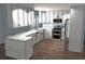 Modern kitchen design with white cabinets and stainless steel appliances at 11278 4Th Ave, Punta Gorda, FL 33955