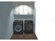 Laundry room with washer and dryer, and white cabinets at 11278 4Th Ave, Punta Gorda, FL 33955