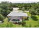 A view of the home from above, highlighting the screened-in pool and landscaped backyard at 1205 Bartlett Ave, North Port, FL 34288