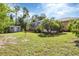 Spacious backyard with shed and lush landscaping at 1205 Bartlett Ave, North Port, FL 34288