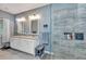 Primary bathroom with double sinks and glass enclosed shower at 1205 Bartlett Ave, North Port, FL 34288