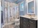 Bright bathroom with a modern vanity and a shower featuring elegant tile and fixtures at 1205 Bartlett Ave, North Port, FL 34288