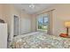 Comfortable bedroom featuring a closet and a sunny window with a peaceful outdoor view at 1205 Bartlett Ave, North Port, FL 34288