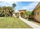 Charming single-story home featuring a walkway and neatly manicured front yard at 1205 Bartlett Ave, North Port, FL 34288
