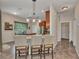 This kitchen has a pendant light over island with seating and stainless appliances at 1205 Bartlett Ave, North Port, FL 34288