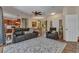 Spacious living room with a gray patterned rug, and dining room access at 1205 Bartlett Ave, North Port, FL 34288