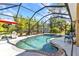 A screened-in pool and patio area provides a perfect spot for outdoor relaxation and entertainment at 1205 Bartlett Ave, North Port, FL 34288