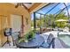 Lanai featuring a table and chairs with a screened-in pool area at 1205 Bartlett Ave, North Port, FL 34288