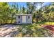 An outdoor shed offers additional storage space and complements the home's exterior at 1205 Bartlett Ave, North Port, FL 34288