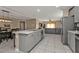 Open concept kitchen with an island, stainless appliances, and seamless flow to the living areas at 18043 Avonsdale Cir, Port Charlotte, FL 33948