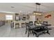 Expansive open-concept living with kitchen, dining area, and tile flooring at 18043 Avonsdale Cir, Port Charlotte, FL 33948