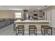 Open kitchen design with a spacious island, stainless steel appliances, and a breakfast bar at 18043 Avonsdale Cir, Port Charlotte, FL 33948