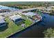 Aerial view of waterfront home with pool and private dock at 21062 Edgewater Dr, Port Charlotte, FL 33952