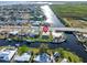 Aerial view of canal-front home with large backyard and patio at 21062 Edgewater Dr, Port Charlotte, FL 33952