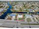 Bird's eye view of a single story home with a pool and spacious lot at 21062 Edgewater Dr, Port Charlotte, FL 33952