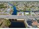 Aerial view of canal-front property and neighborhood at 21062 Edgewater Dr, Port Charlotte, FL 33952