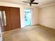 Bedroom with access to sunroom and mirrored closet doors at 21062 Edgewater Dr, Port Charlotte, FL 33952