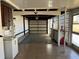 View of a spacious garage with tile flooring and ample storage at 21062 Edgewater Dr, Port Charlotte, FL 33952