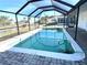 Relaxing screened-in pool with canal views at 21062 Edgewater Dr, Port Charlotte, FL 33952
