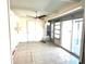 Bright sunroom with tile floors and access to the pool area at 21062 Edgewater Dr, Port Charlotte, FL 33952