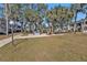 Landscaped lawn with paved patio and building view at 21320 Brinson Ave # 117, Port Charlotte, FL 33952