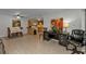 Open living area with dining, kitchen and seating at 21320 Brinson Ave # 117, Port Charlotte, FL 33952