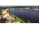 Aerial view of lakefront homes and lush landscaping at 26247 Stillwater Cir, Punta Gorda, FL 33955