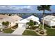 Single-Gathering home with lake view, landscaped yard, and two-car garage at 26247 Stillwater Cir, Punta Gorda, FL 33955