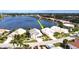 Aerial view of property near lake and other homes at 26247 Stillwater Cir, Punta Gorda, FL 33955