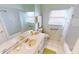 Clean bathroom with shower/tub combo, double vanity, and updated fixtures at 26247 Stillwater Cir, Punta Gorda, FL 33955