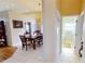 Open dining area with adjacent kitchen and hallway bathroom at 26247 Stillwater Cir, Punta Gorda, FL 33955