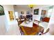 Open concept dining room with views into living room and kitchen at 26247 Stillwater Cir, Punta Gorda, FL 33955