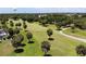 Aerial view of a golf course with palm trees at 26247 Stillwater Cir, Punta Gorda, FL 33955