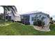 Well-maintained house exterior with landscaping and lake view at 26247 Stillwater Cir, Punta Gorda, FL 33955