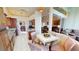 Bright kitchen with granite countertops, wood cabinets, and breakfast nook at 26247 Stillwater Cir, Punta Gorda, FL 33955