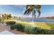 Stunning lake view from the backyard, lush landscaping at 26247 Stillwater Cir, Punta Gorda, FL 33955