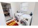 Laundry room with washer, dryer, and additional storage at 26247 Stillwater Cir, Punta Gorda, FL 33955