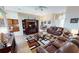 Relaxing living room with leather furniture and a view to the kitchen at 26247 Stillwater Cir, Punta Gorda, FL 33955