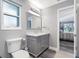 Bathroom with gray vanity, marble countertop and view of bedroom at 2910 Guadalupe Dr, Punta Gorda, FL 33950