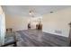 Bright living room featuring gray vinyl plank flooring and ample natural light at 2910 Guadalupe Dr, Punta Gorda, FL 33950